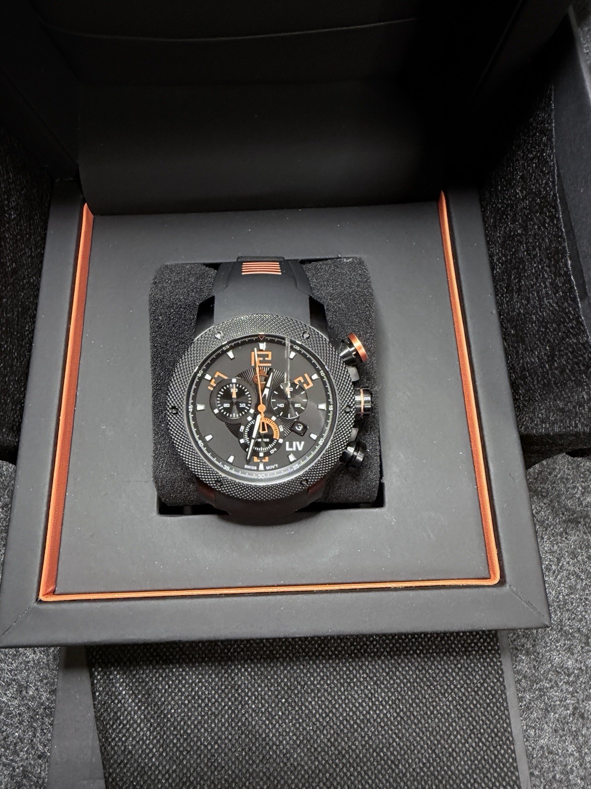 LIV GX1 Signature Orange On A Black Silicone With Orange Accents Strap