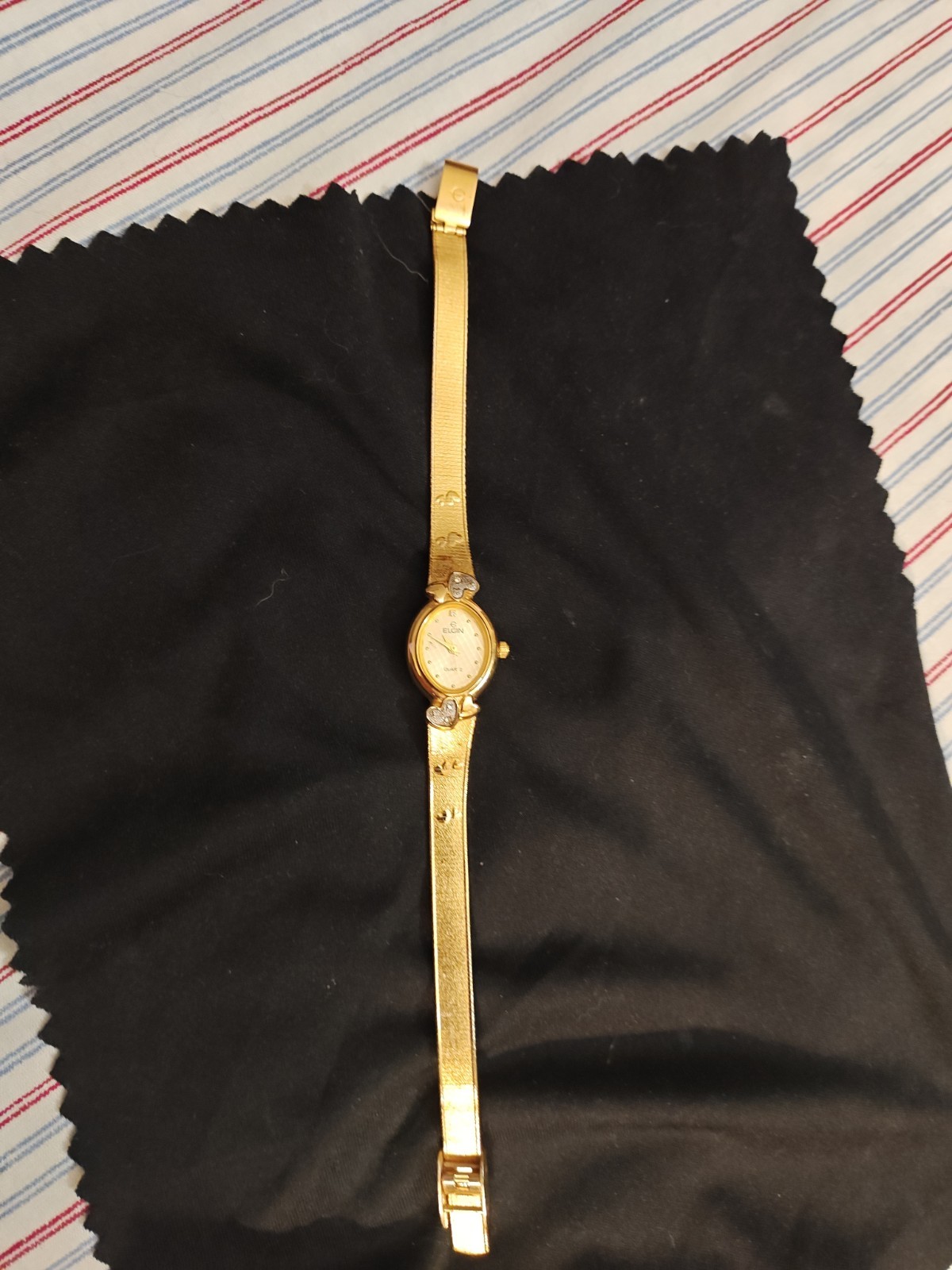 a beautiful antique elgin gold watch with hearts , dainty, oval ,and elegant…