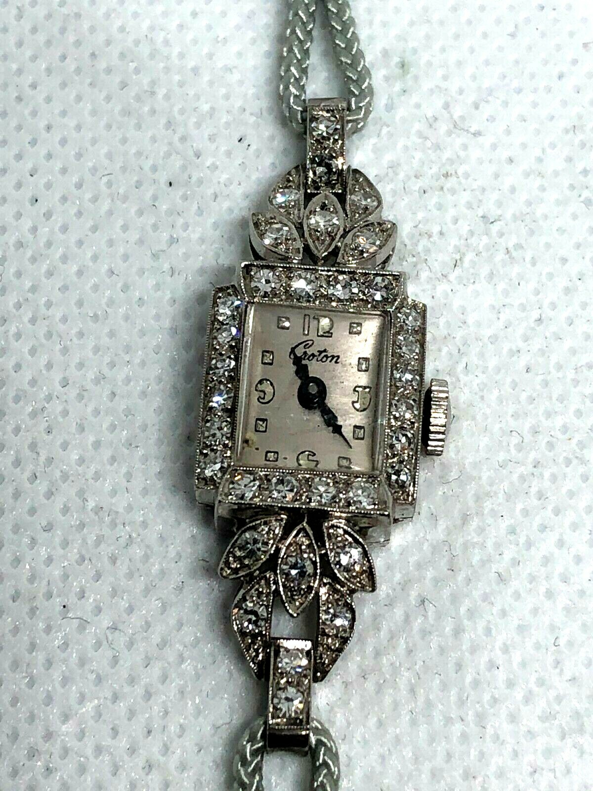 CROTON LADIES PLATINUM AND DIAMOND WRIST WATCH