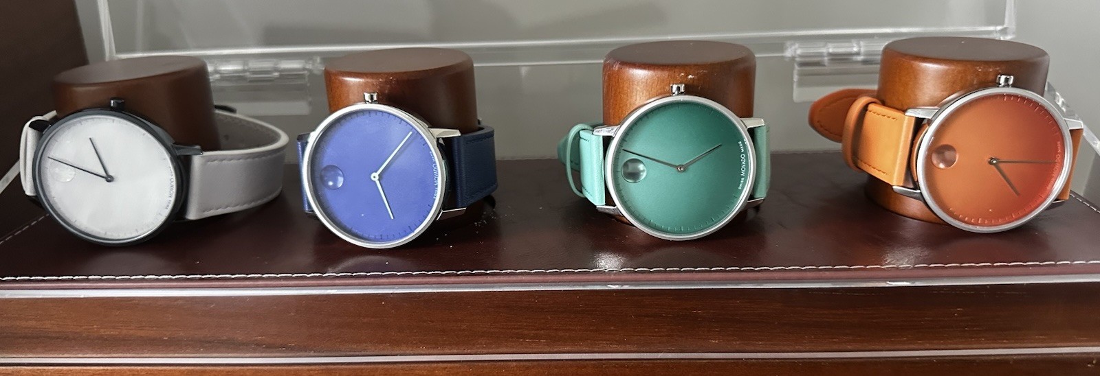 MOVADO SIGNATURE SET BLUE, TEAL, ORANGE, WHITE-LEATHER STRAPS STAINLESS CASE.
