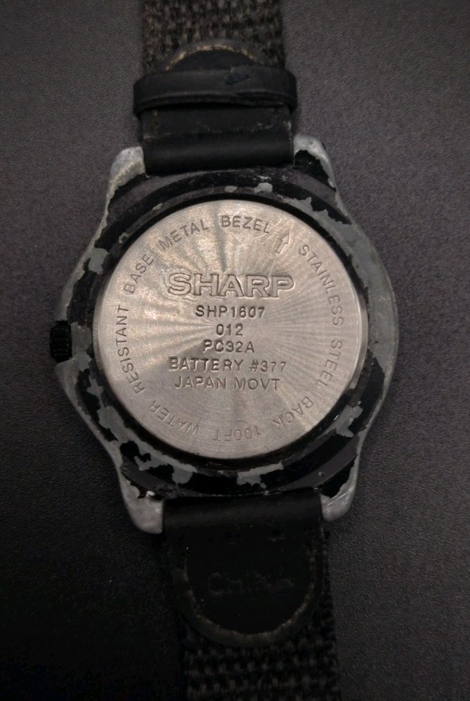 Sharp SHP-1607 Water Resistant to 100 feet Wristwatch. Needs battery.