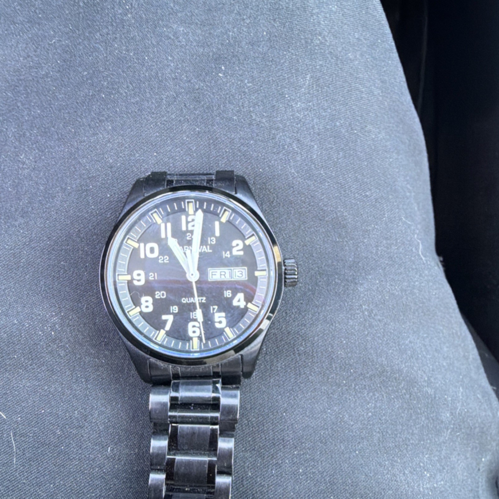 Carnival Quartz Men’s Stainless Steel Black Dial Arabic Day/Date Wristwatch