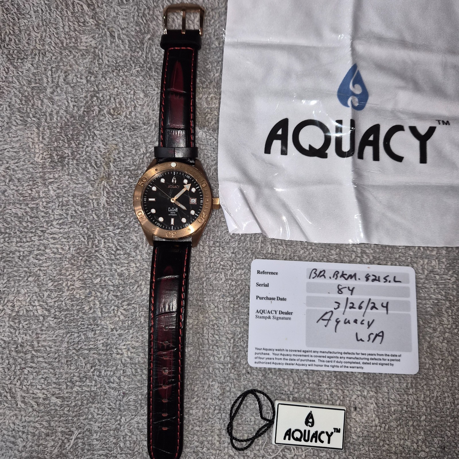 AQUACY bronze watch with black marble dial. Original leather strap. Never worn.