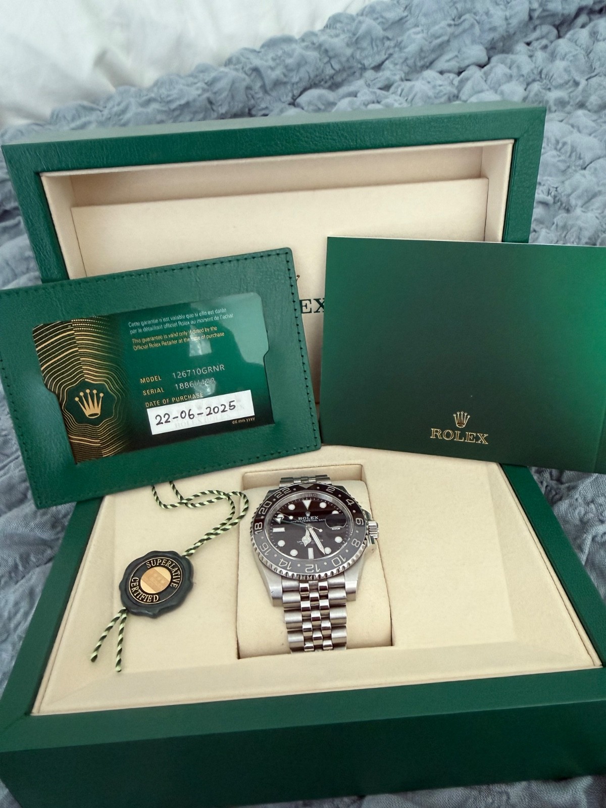 Rolex GMT Master II Bruce Wayne Jubilee 2025 – 126710GRNR Complete with Papers