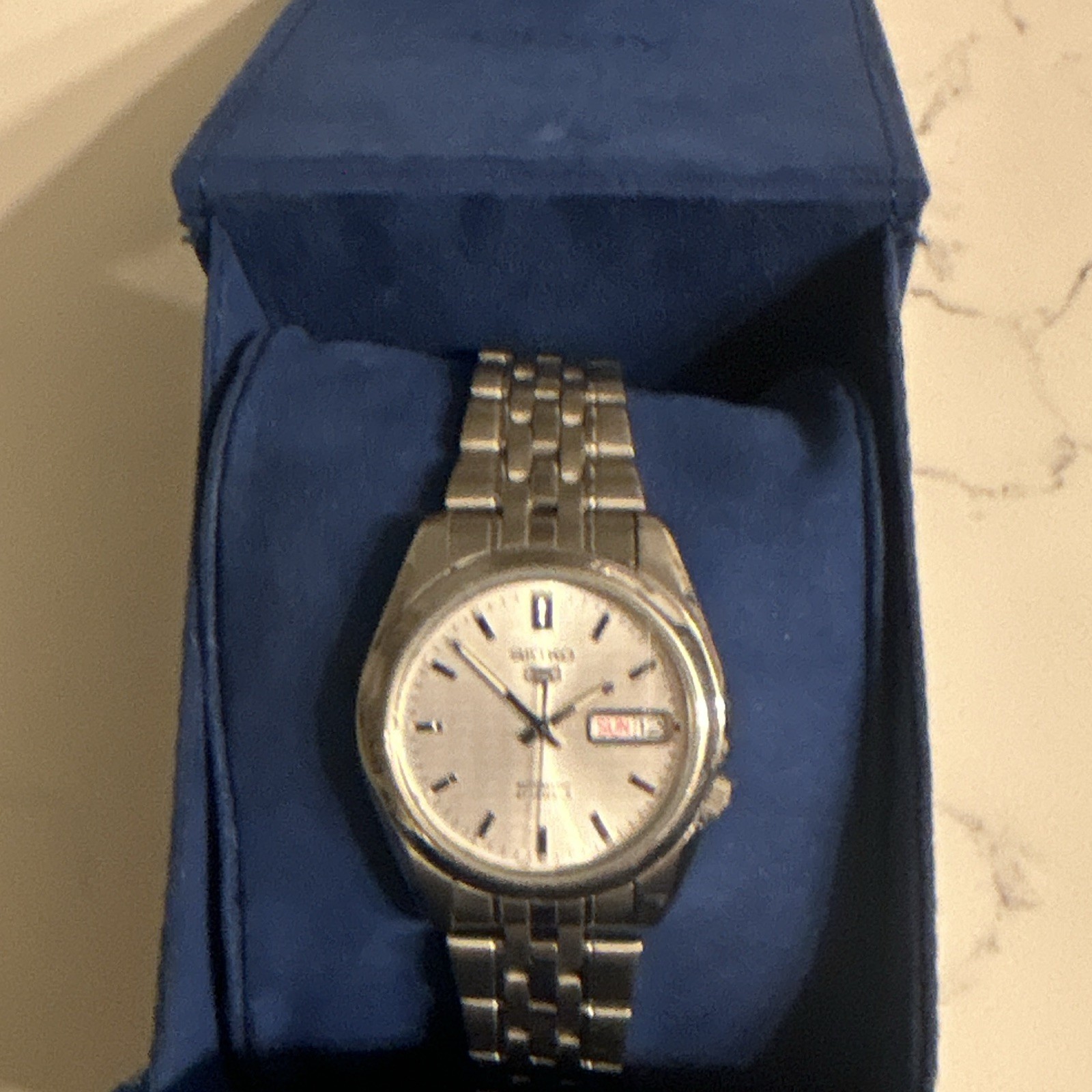 Seiko 5 Men’s Automatic Day/Date Silver Sunburst Dial SS Bracelet Watch