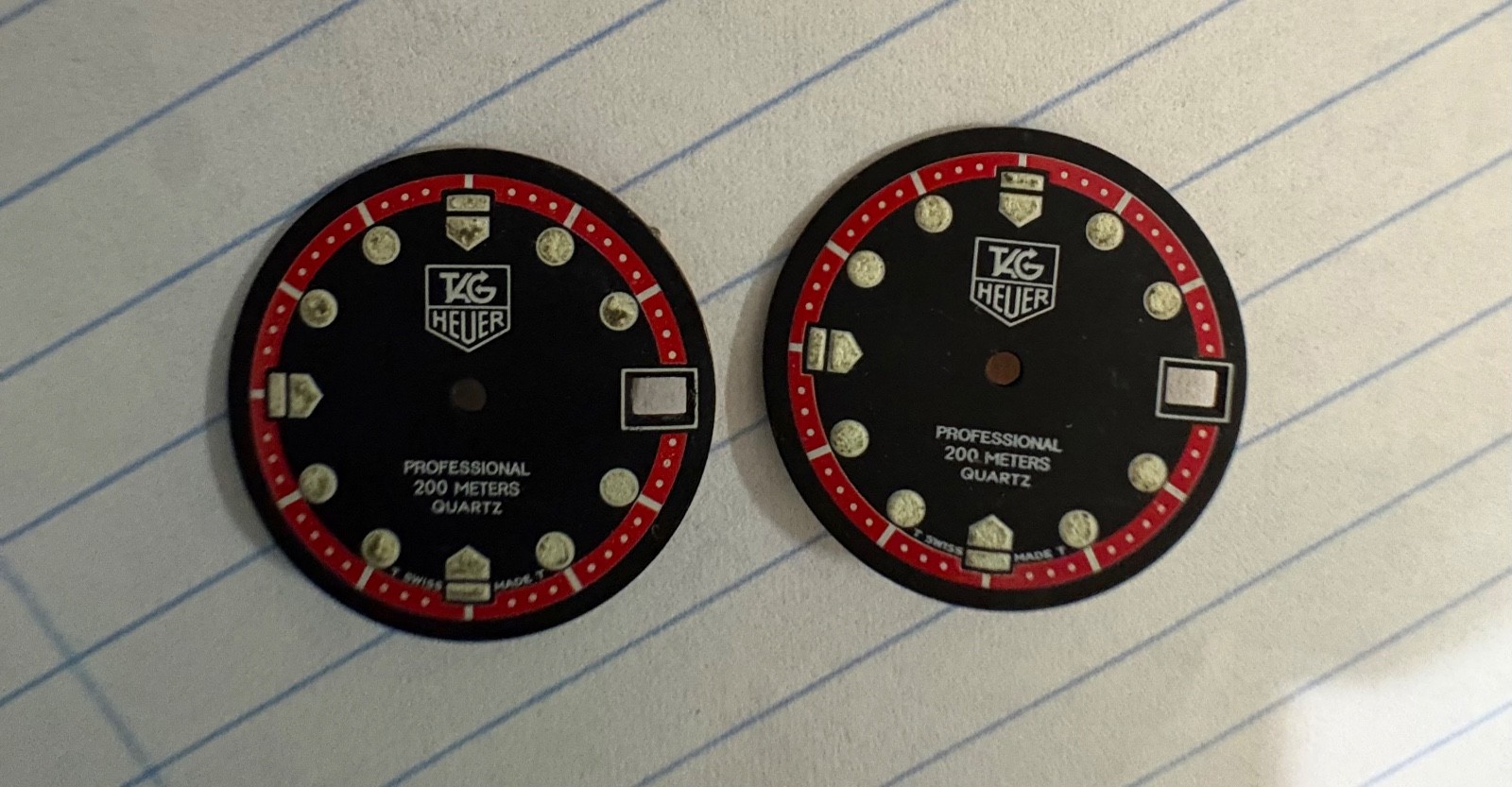 Tag Heuer watch faces – two – black with red detail, 23mm across