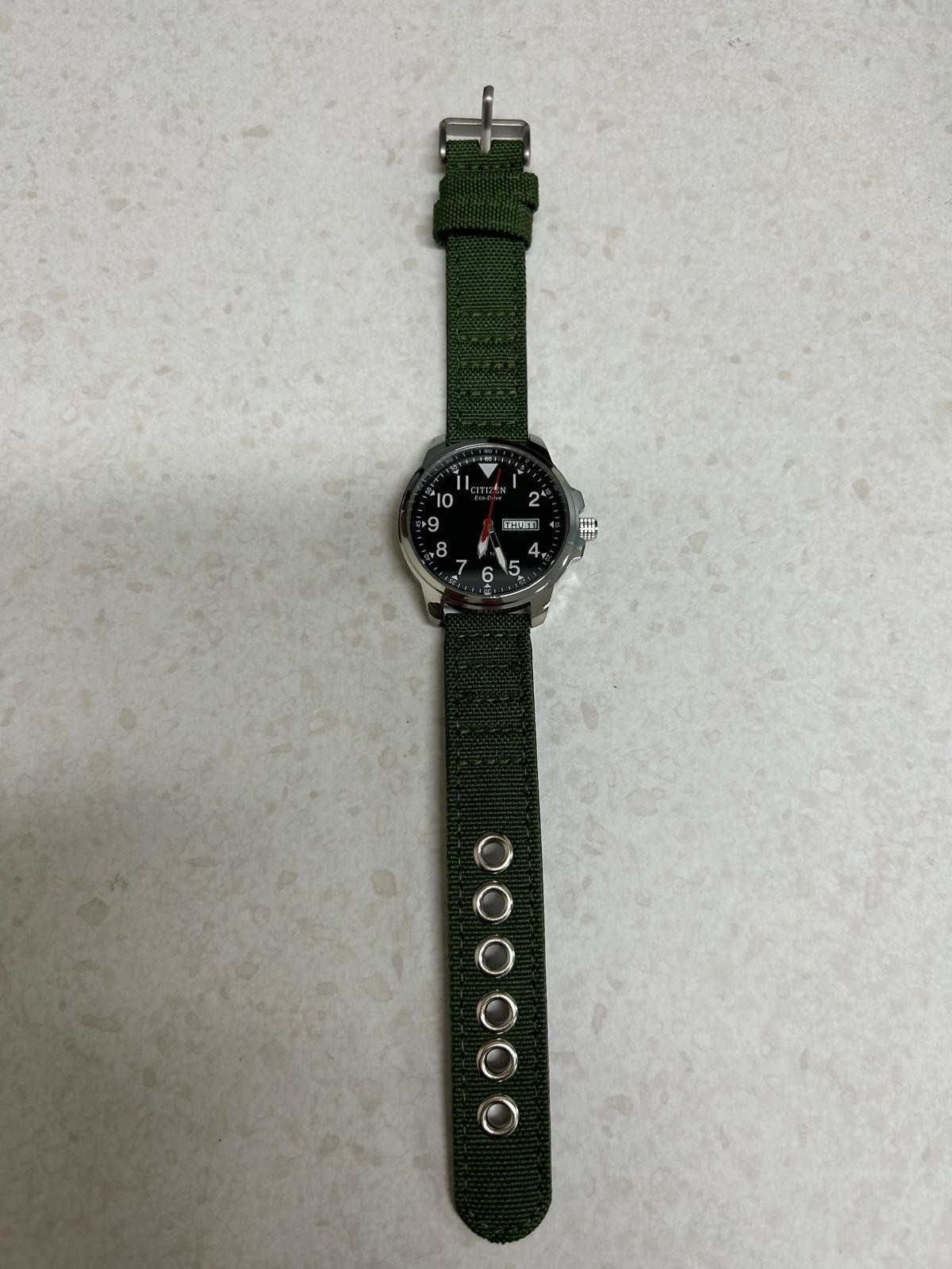 Citizen Men’s Eco-Drive Black Dial Green Strap Field Watch BM8180-03E fresh