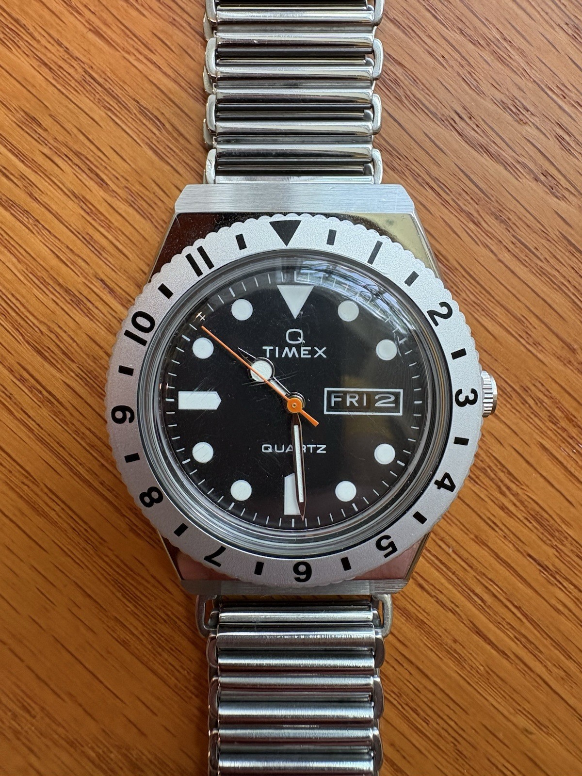 Timex Q Reissue, 12-hr dual-time bidirectional bezel, Bonklip-style bracelet.