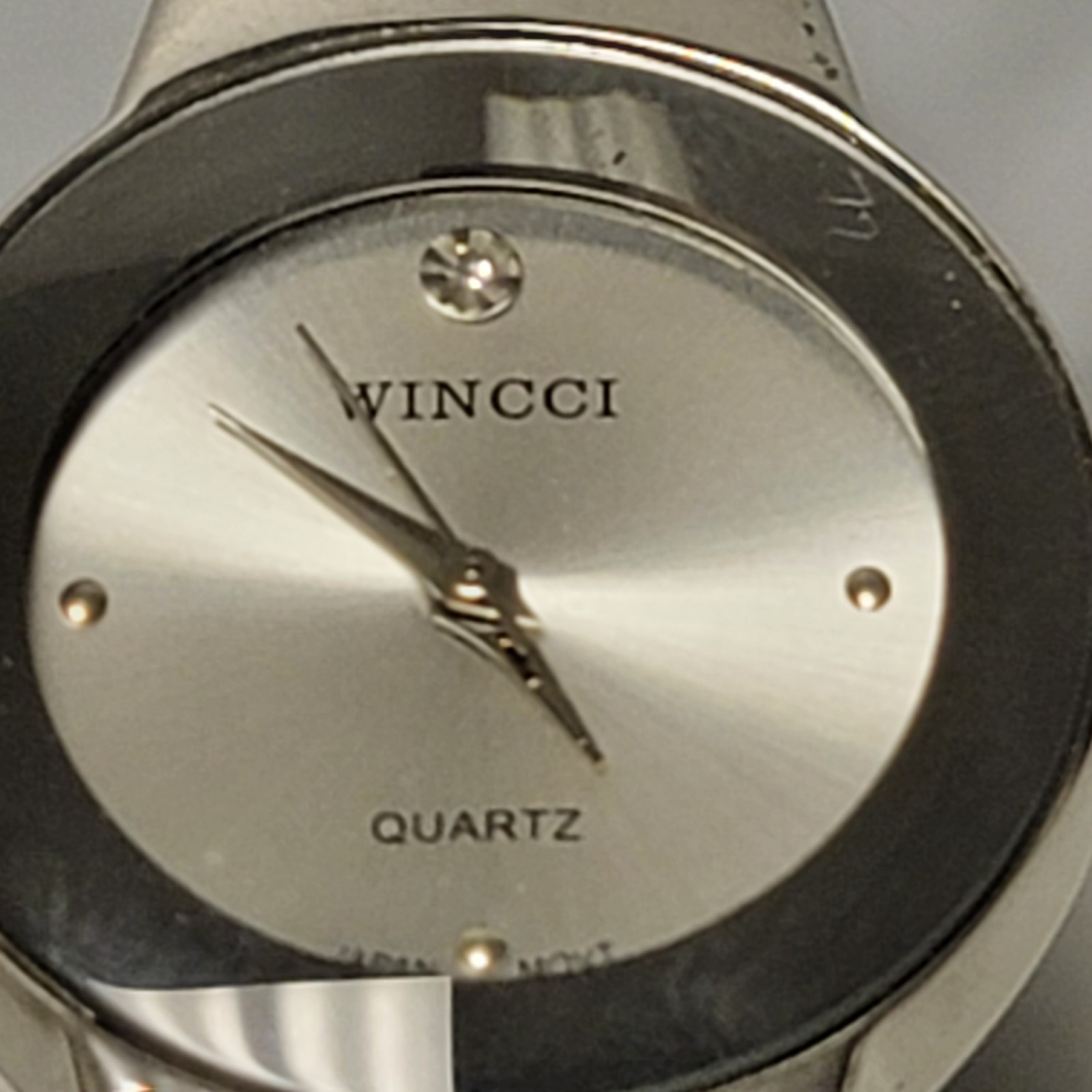 Wincci Analog Wristwatch with Spring Cuff Band and Quartz Movement