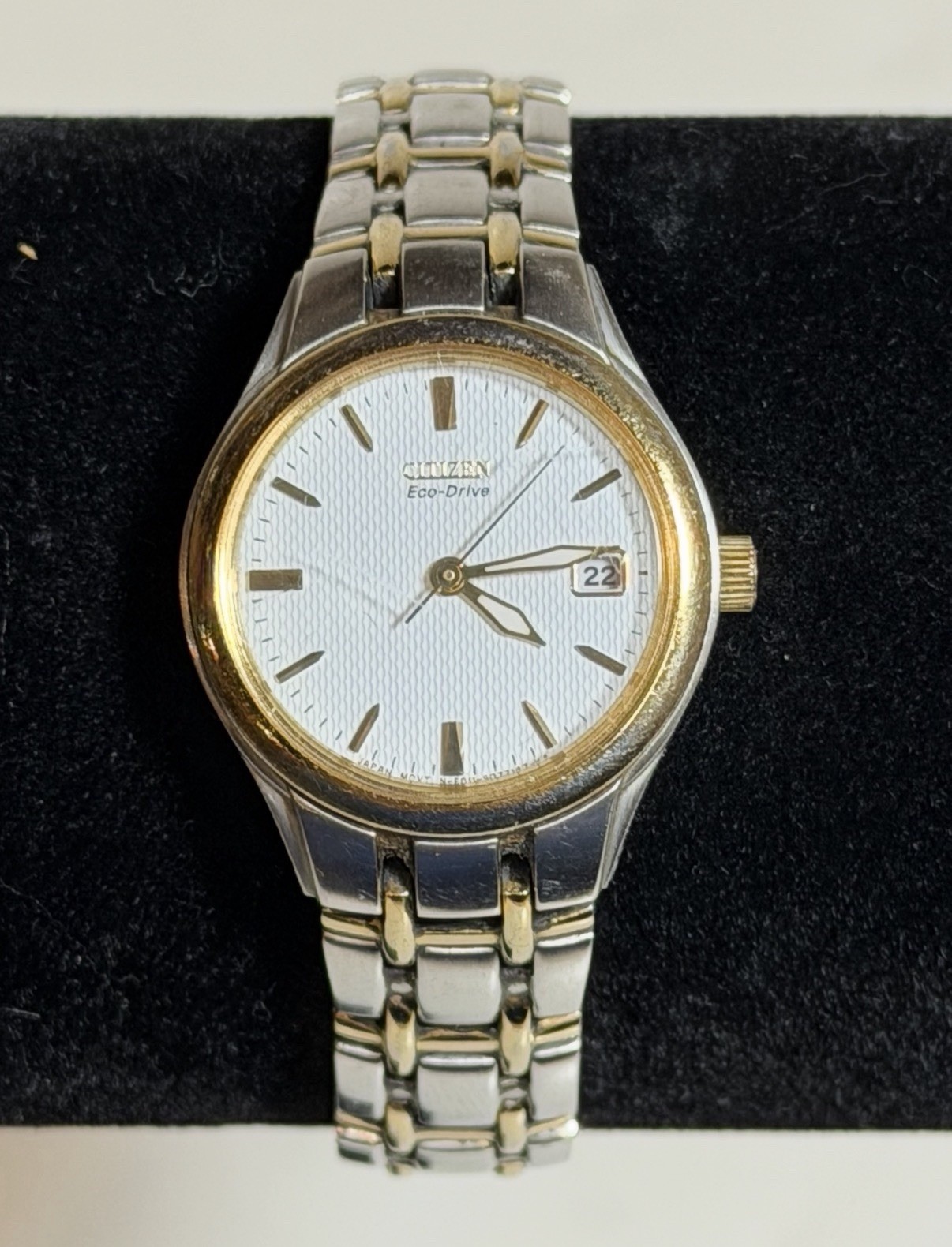 Citizen Eco-Drive E011-S049571 White Dial Date Silver Gold Tone Woman’s Watch