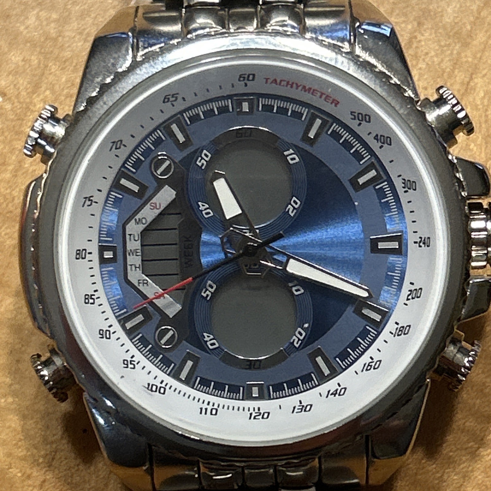 Men’s Silver/Blue/White Tachymeter Chronograph Folding Clasp Watch Needs Battery