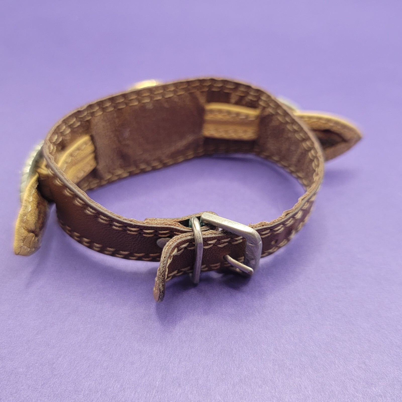 Vintage women’s Bonetto Quartz gold frame watch with leather band