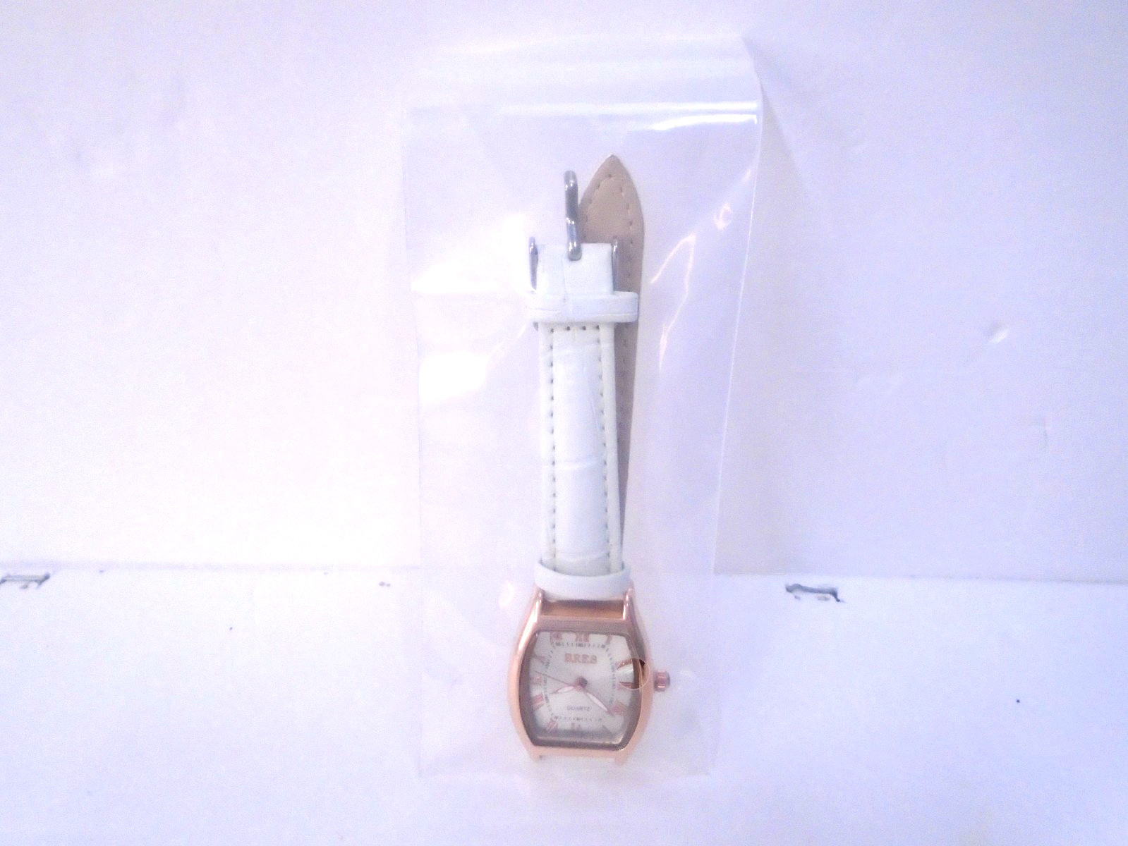 BRES Women’s Watch square quartz rose gold-tone case and white strap.