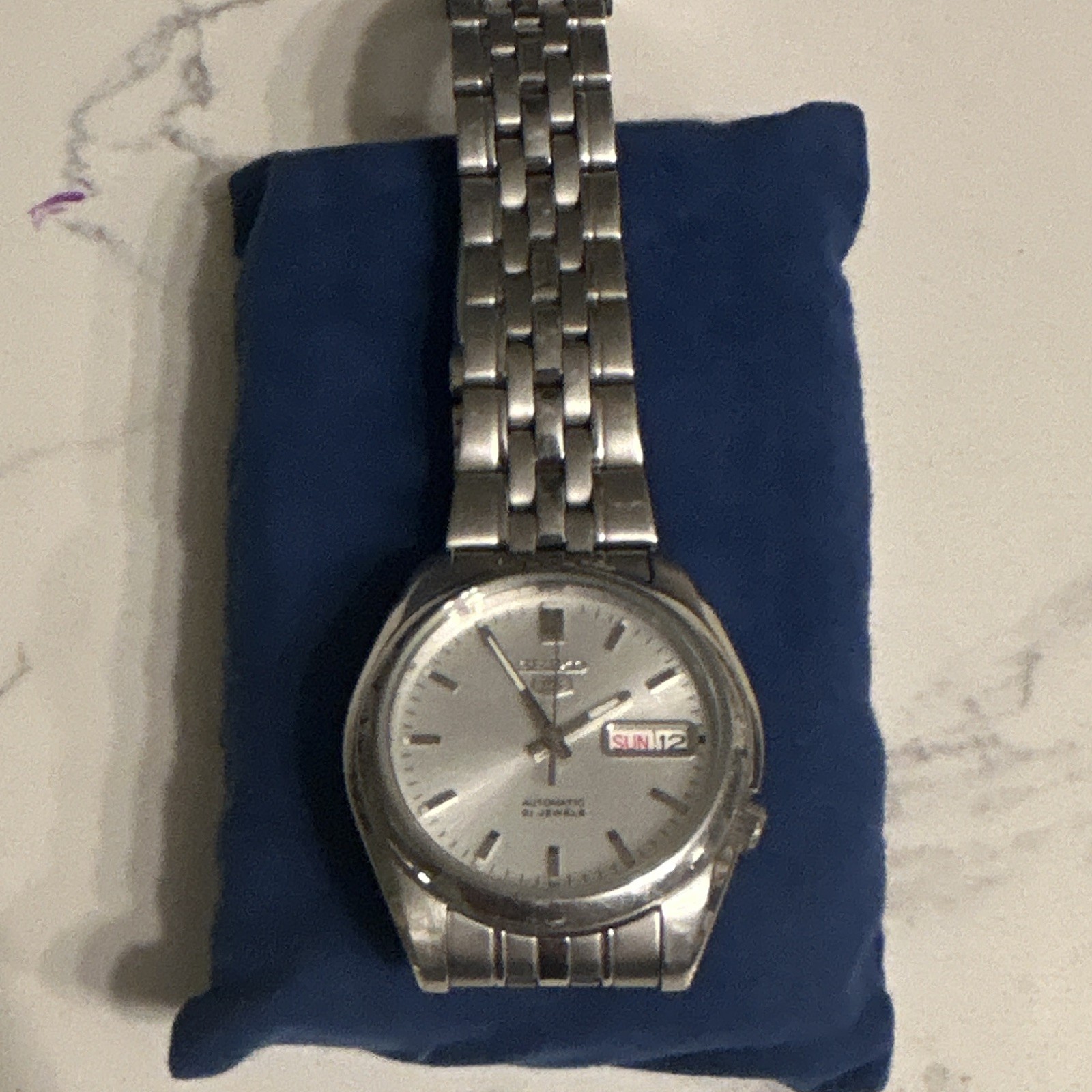Seiko 5 Men’s Automatic Day/Date Silver Sunburst Dial SS Bracelet Watch