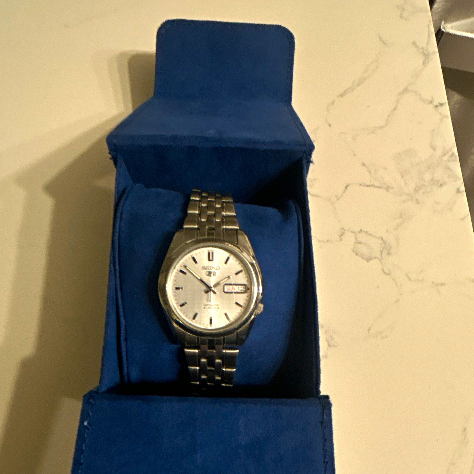 Seiko 5 Men’s Automatic Day/Date Silver Sunburst Dial SS Bracelet Watch