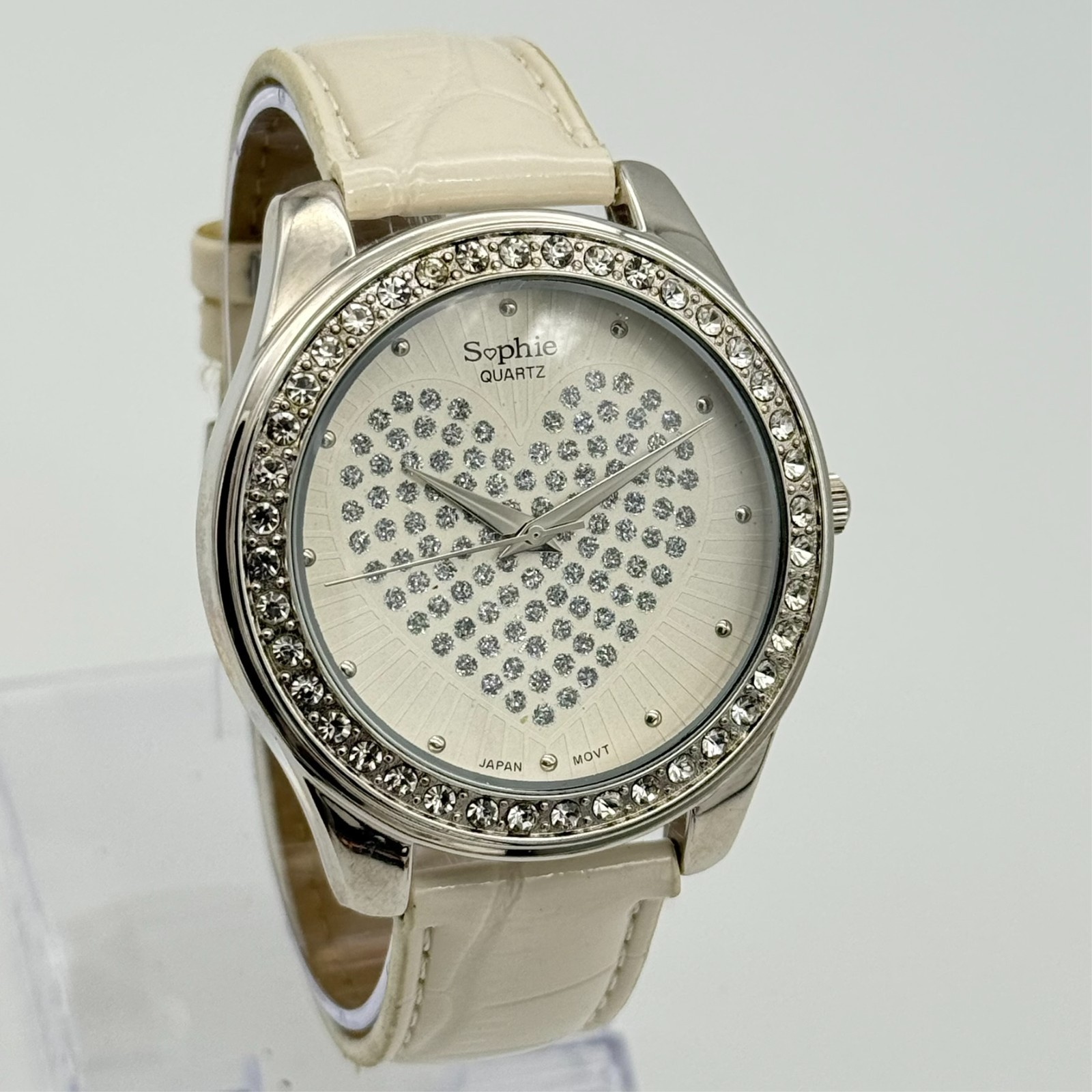 Women’s SOPHIE Silver Tone Crystal Heart Dial Watch, White Band, 45mm, Runs