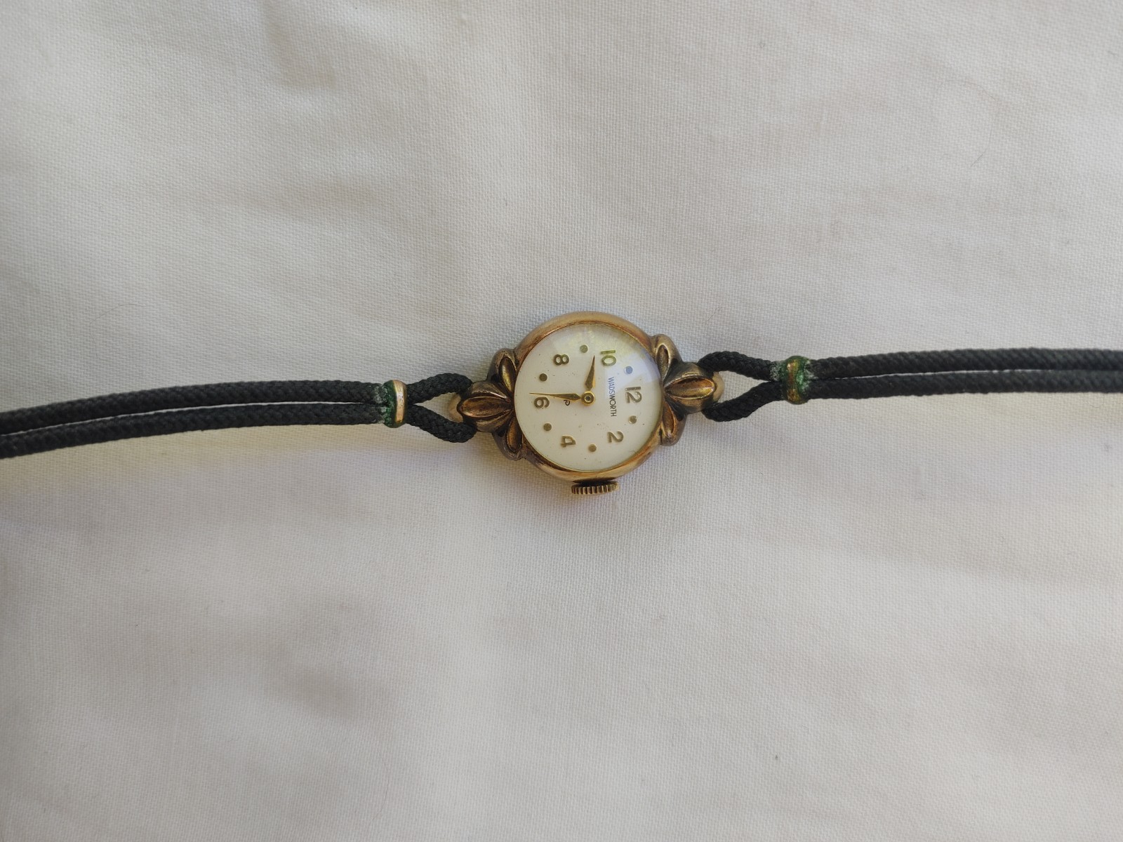 Wadsworth Vintage Gold Tone Round Analog Women’s Wristwatch Black Cord Band