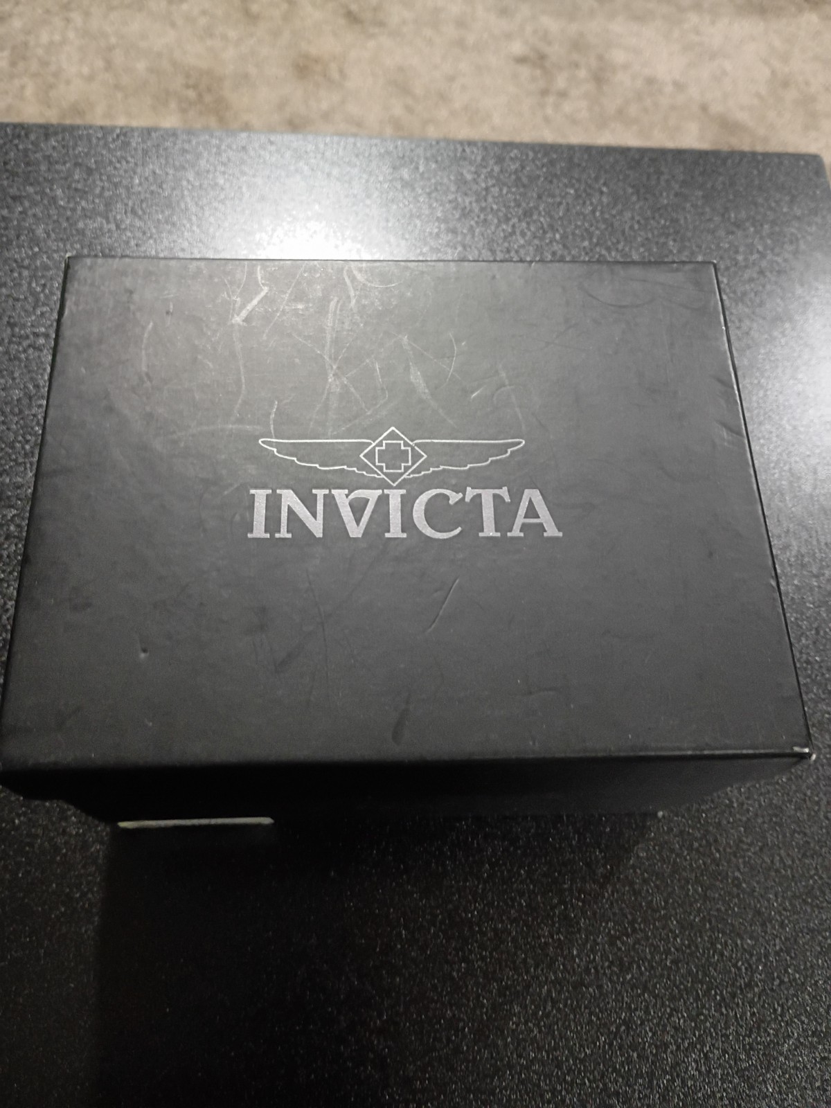 Invicta Marvel Men’s Quartz Chronograph Tachymeter Black/Gold Dial Red Strap Box