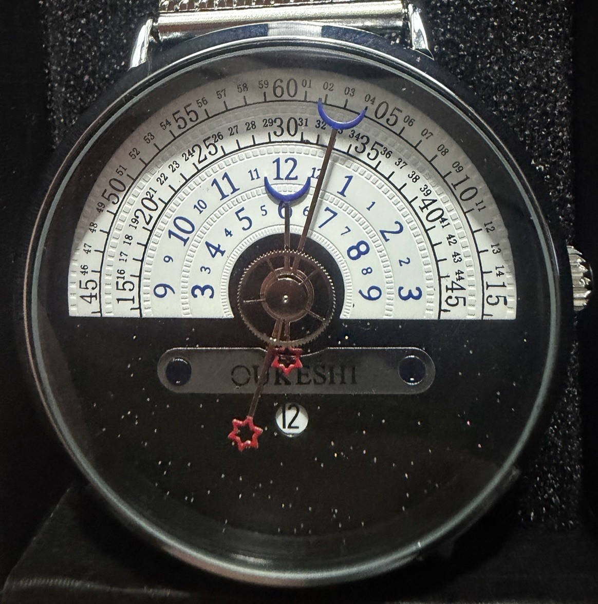 OUKESHI Orbit Dial Quartz Watch Mens Moon and Stars Pointer Steel Mesh Band