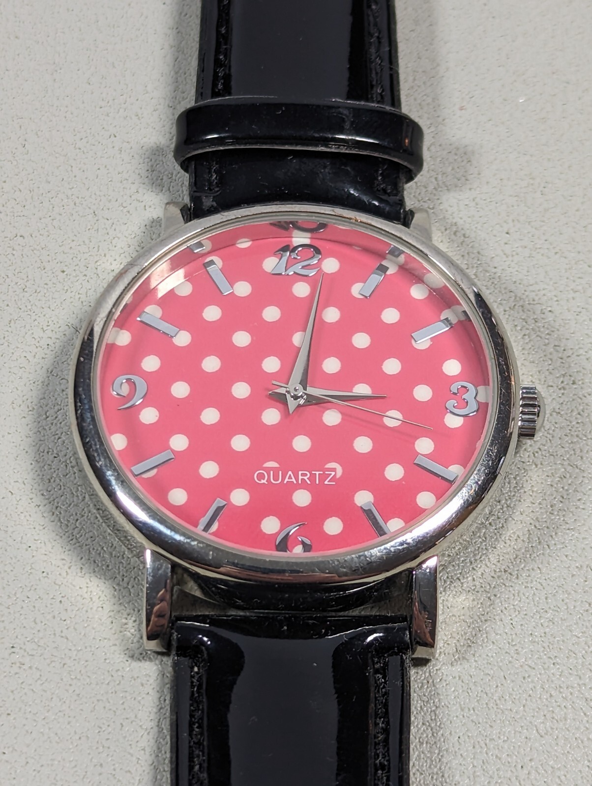 Pink White Polka Dot Dial Round Silver Tone Case Black Faux Leather Band Watch
