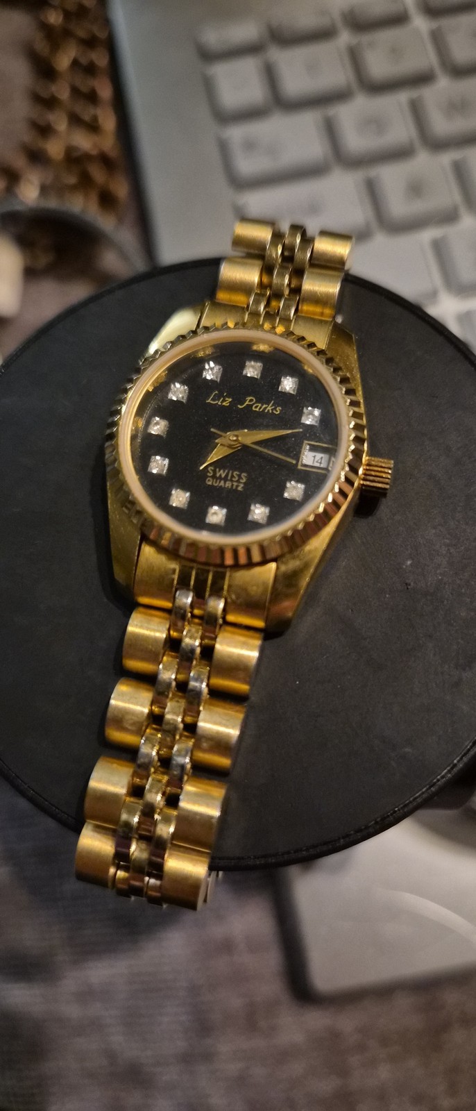 Liz Parks Women’s Gold Black Metal Analog Watch Day Date 22mm