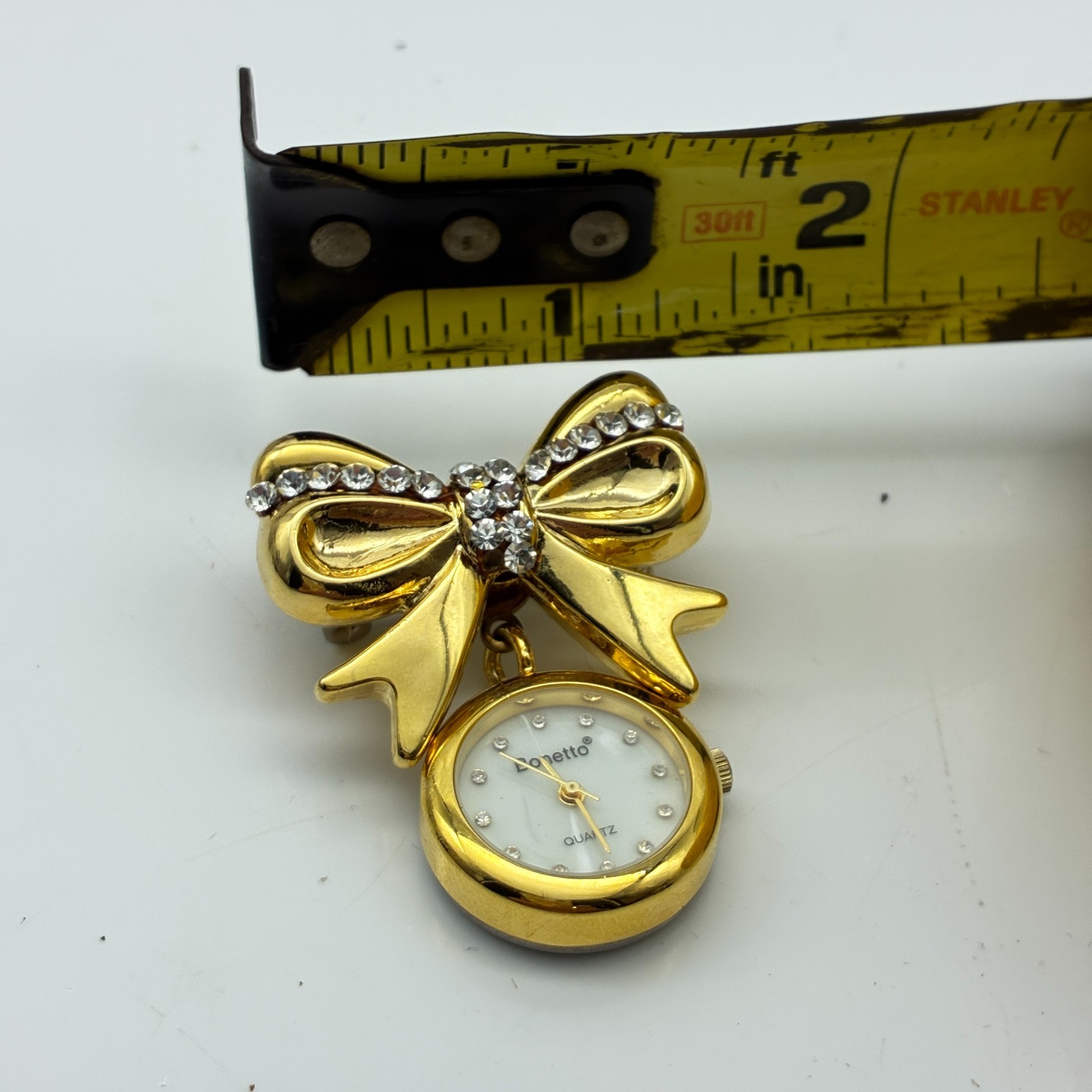 Bonetto Bow Brooch Watch Gold Tone Rhinestone Dangle Quartz Pin