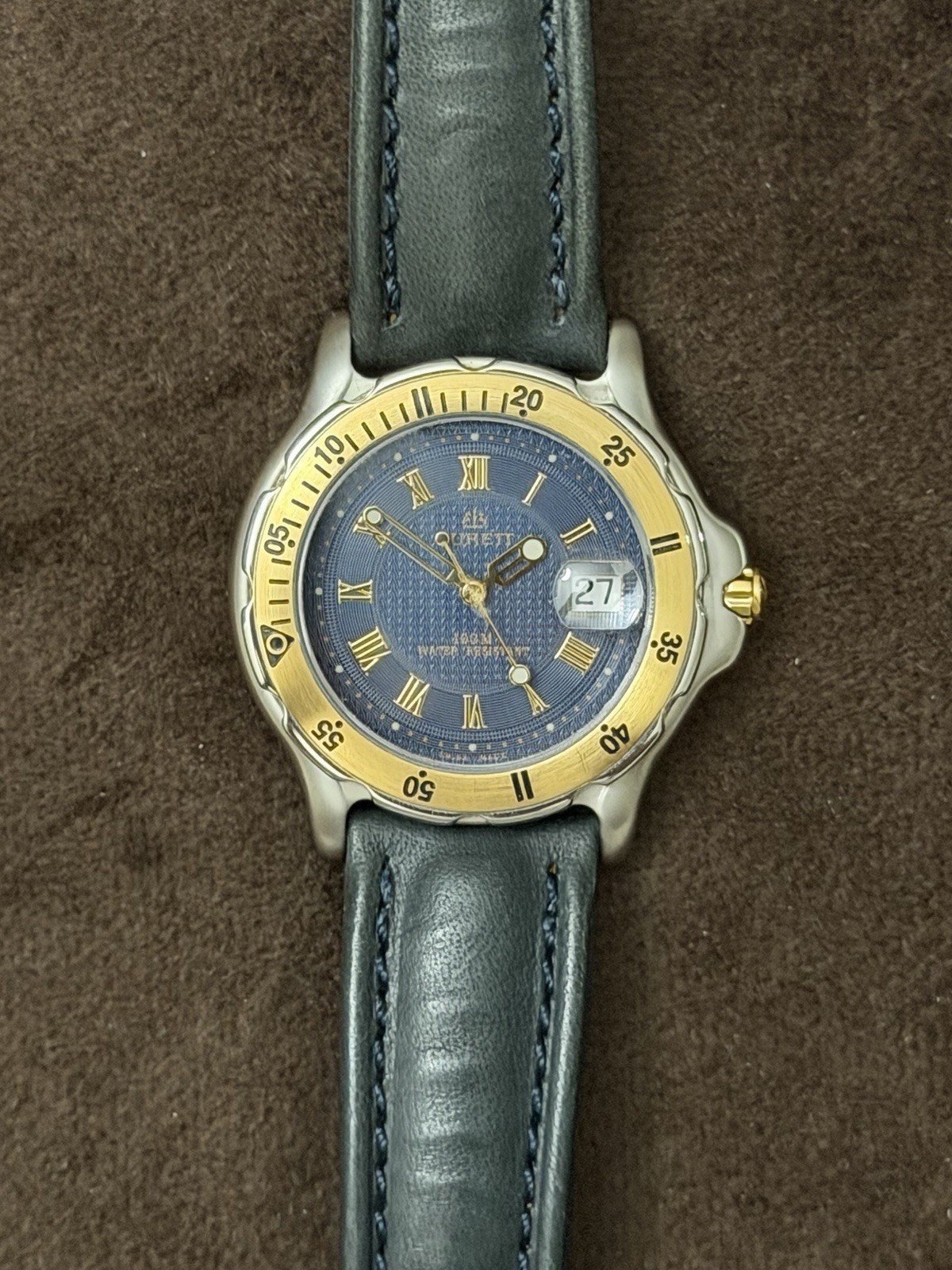 Burett B1520CD Quartz Watch Blue Dial Roman Numerals Date Gold Bezel 100m
