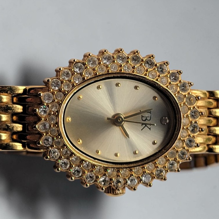 JBK Womens Gold Oval Elegant Dress Watch Gemmed Bracelet Quartz Jewelry Clasp