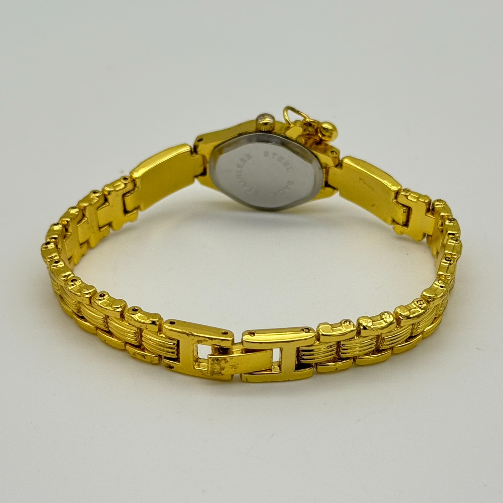 Women’s Gold Tone Classic Petite Bracelet Watch, White Dial, Runs, Heart Charm