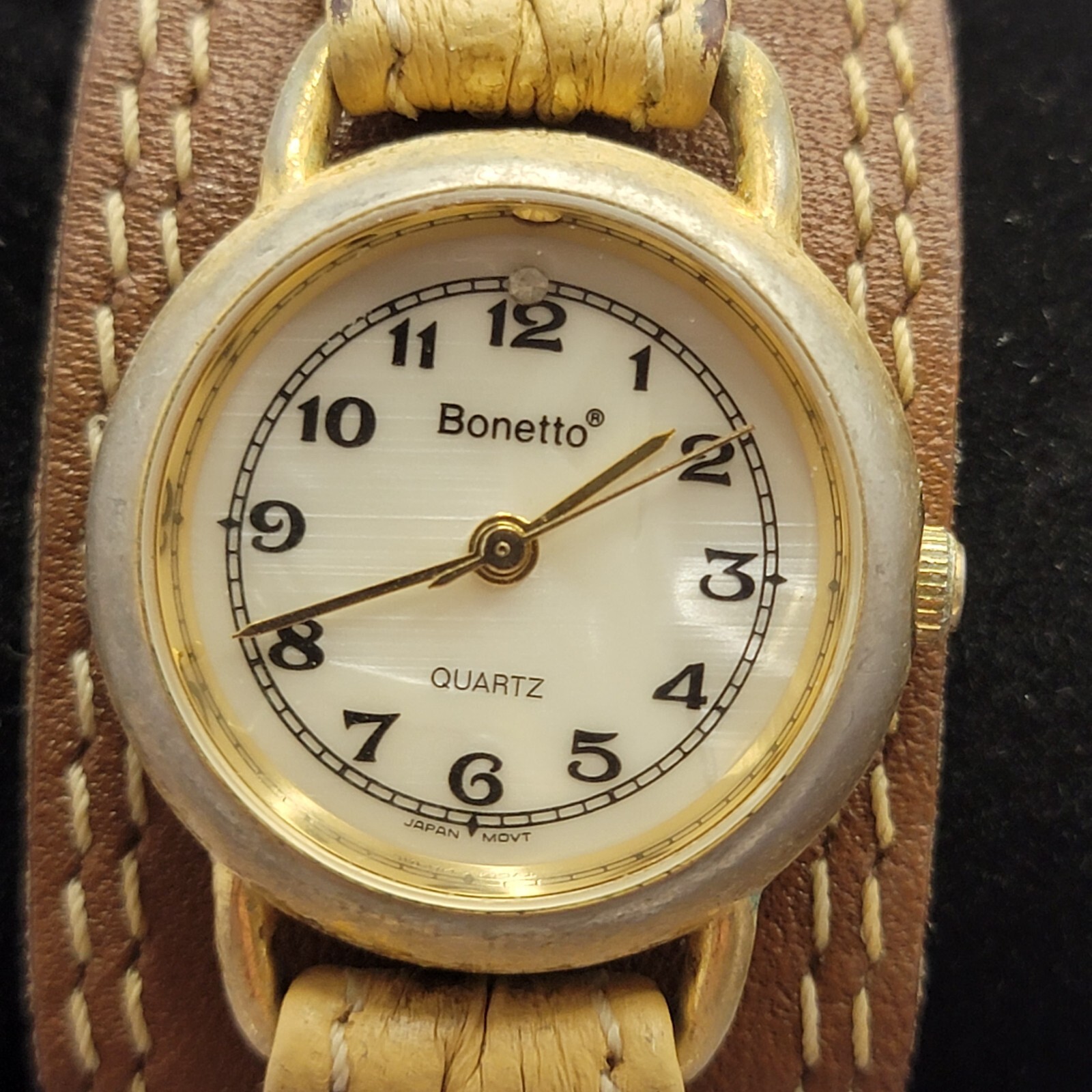 Vintage women’s Bonetto Quartz gold frame watch with leather band