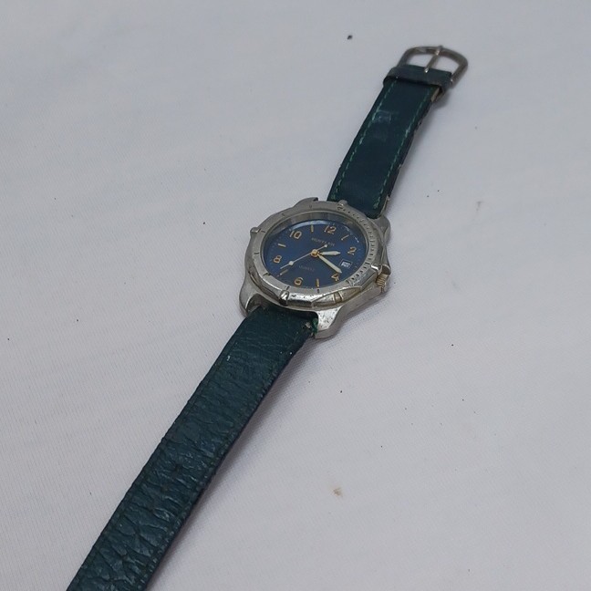 Rustler Quartz Analog Wristwatch Blue Dial Date Silver Case Green Leather Strap