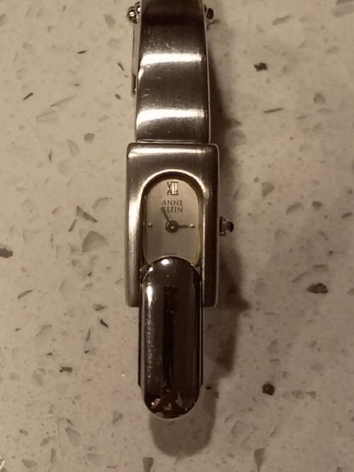 Anne Klein II Silver Tone Flip Top Hidden Dial Cover Bangle Watch 12/6764