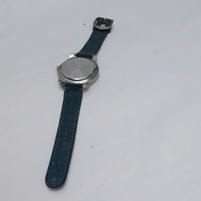 Rustler Quartz Analog Wristwatch Blue Dial Date Silver Case Green Leather Strap