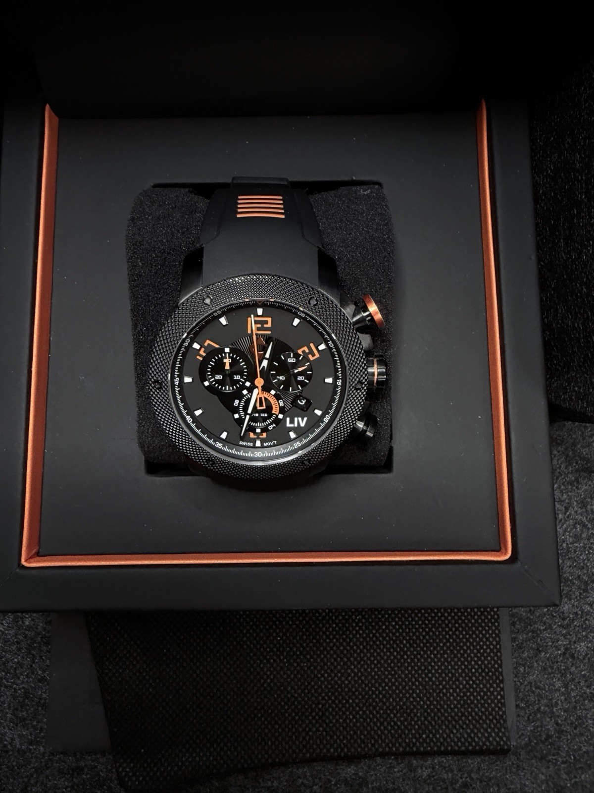 LIV GX1 Signature Orange On A Black Silicone With Orange Accents Strap