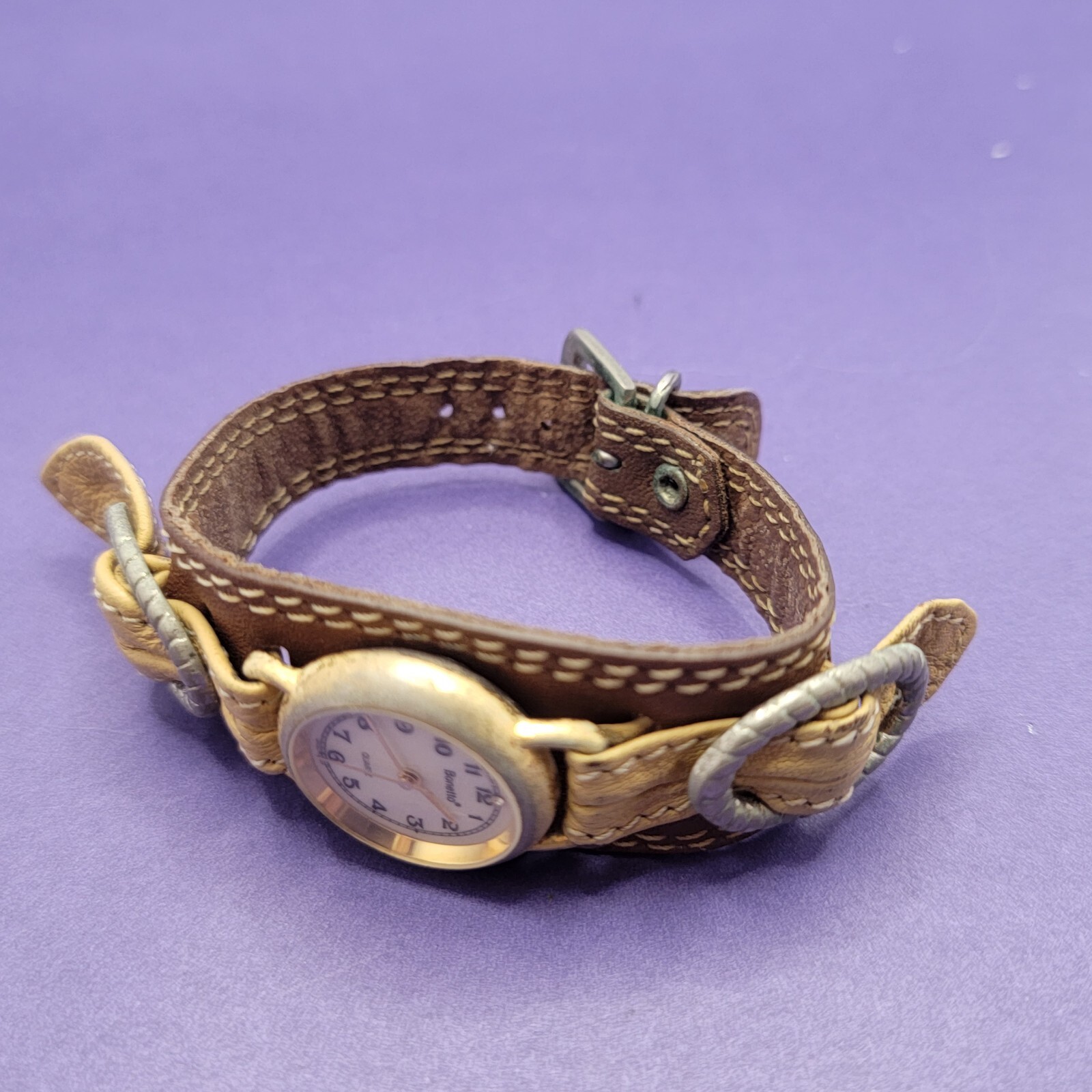 Vintage women’s Bonetto Quartz gold frame watch with leather band