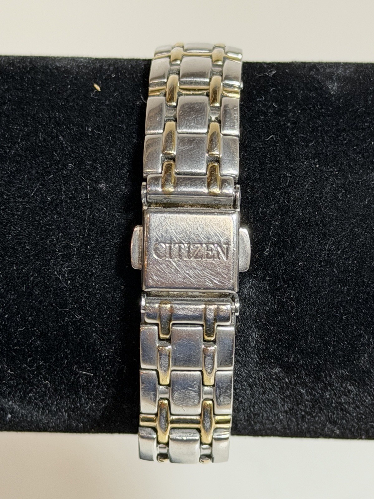 Citizen Eco-Drive E011-S049571 White Dial Date Silver Gold Tone Woman’s Watch