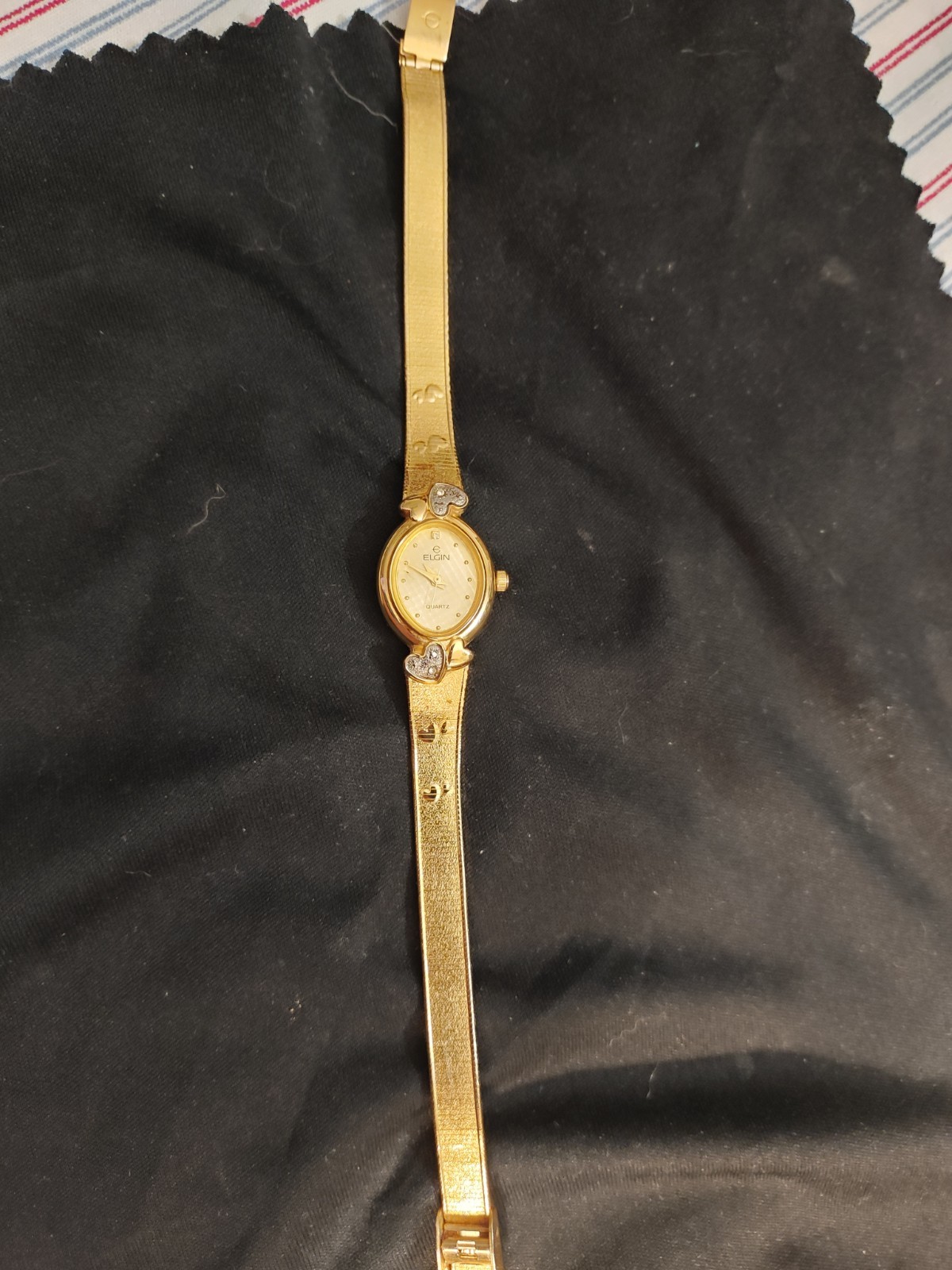 a beautiful antique elgin gold watch with hearts , dainty, oval ,and elegant…