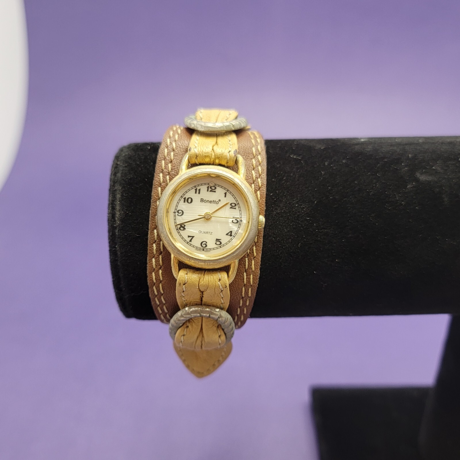 Vintage women’s Bonetto Quartz gold frame watch with leather band